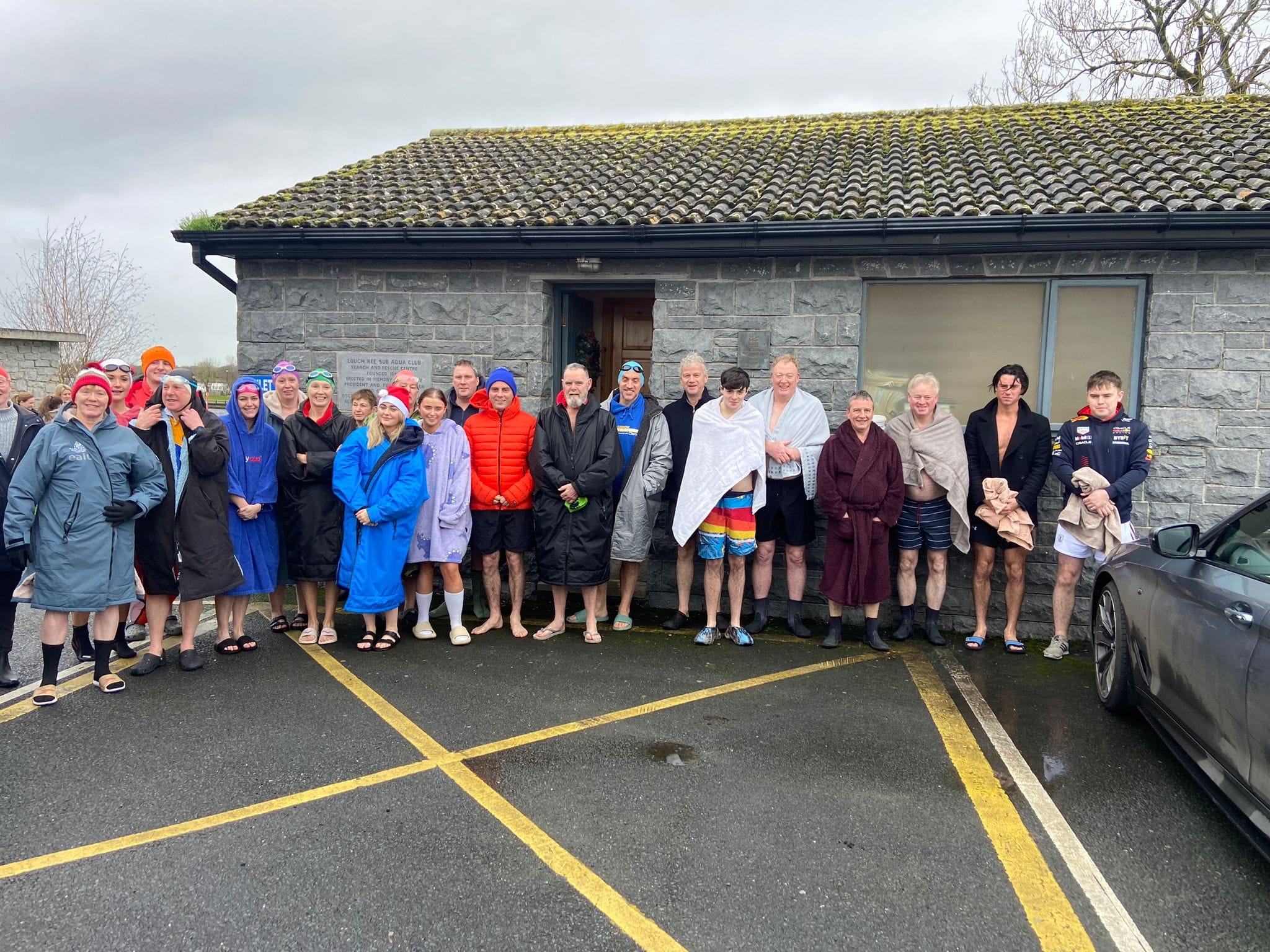 Group photo of members outside the clubhouse